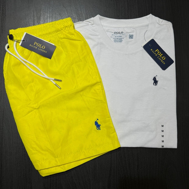 Yellow shorts and white t-shirt with Polo Ralph Lauren logo on a dark surface