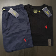 Navy shorts and black t-shirt with Polo Ralph Lauren logo on a dark surface